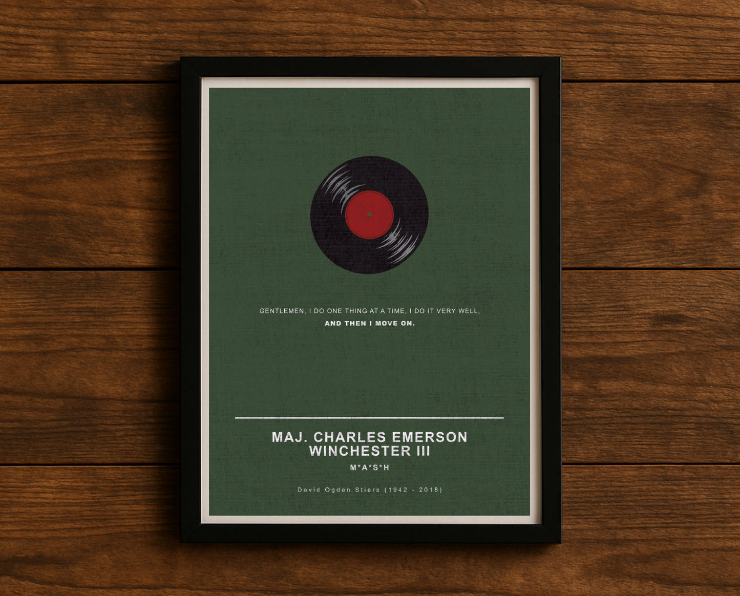 MASH TV series quote digital poster titled "Maj. Charles Emerson Winchester III" featuring his quote "Gentlemen, I do one thing at a time, I do it VERY well, and then I move on." on an army green textured background with an art design of Winchester’s vinyl record.