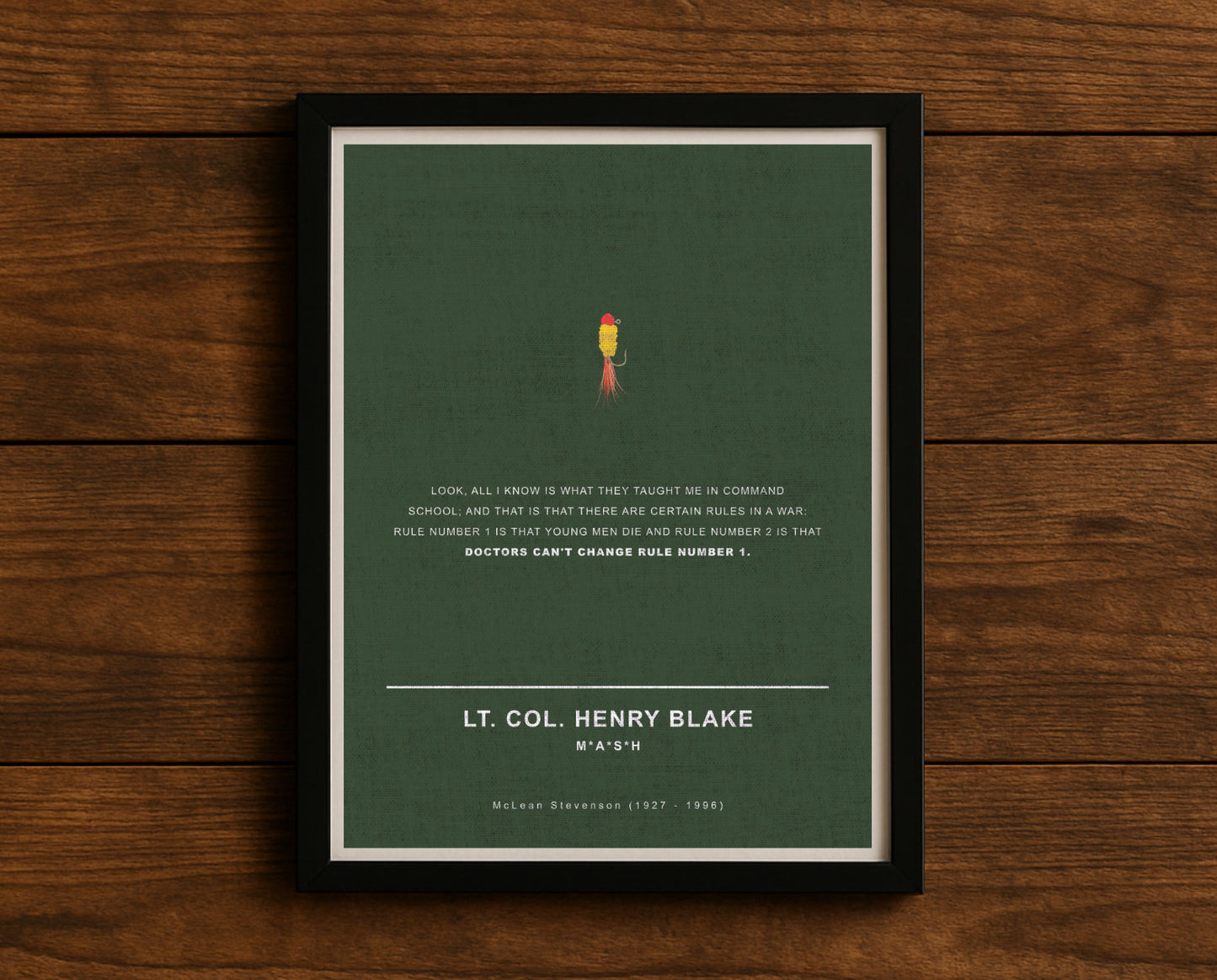 MASH TV series quote digital poster titled "Col. Henry Blake" featuring his quote "Look, all I know is what they taught me in command school; and that is that there are certain rules in a war: rule number 1 is that young men die and rule number 2 is that doctors can't change rule number 1." on an army green textured background with an art design of Henry’s fishing tackle.