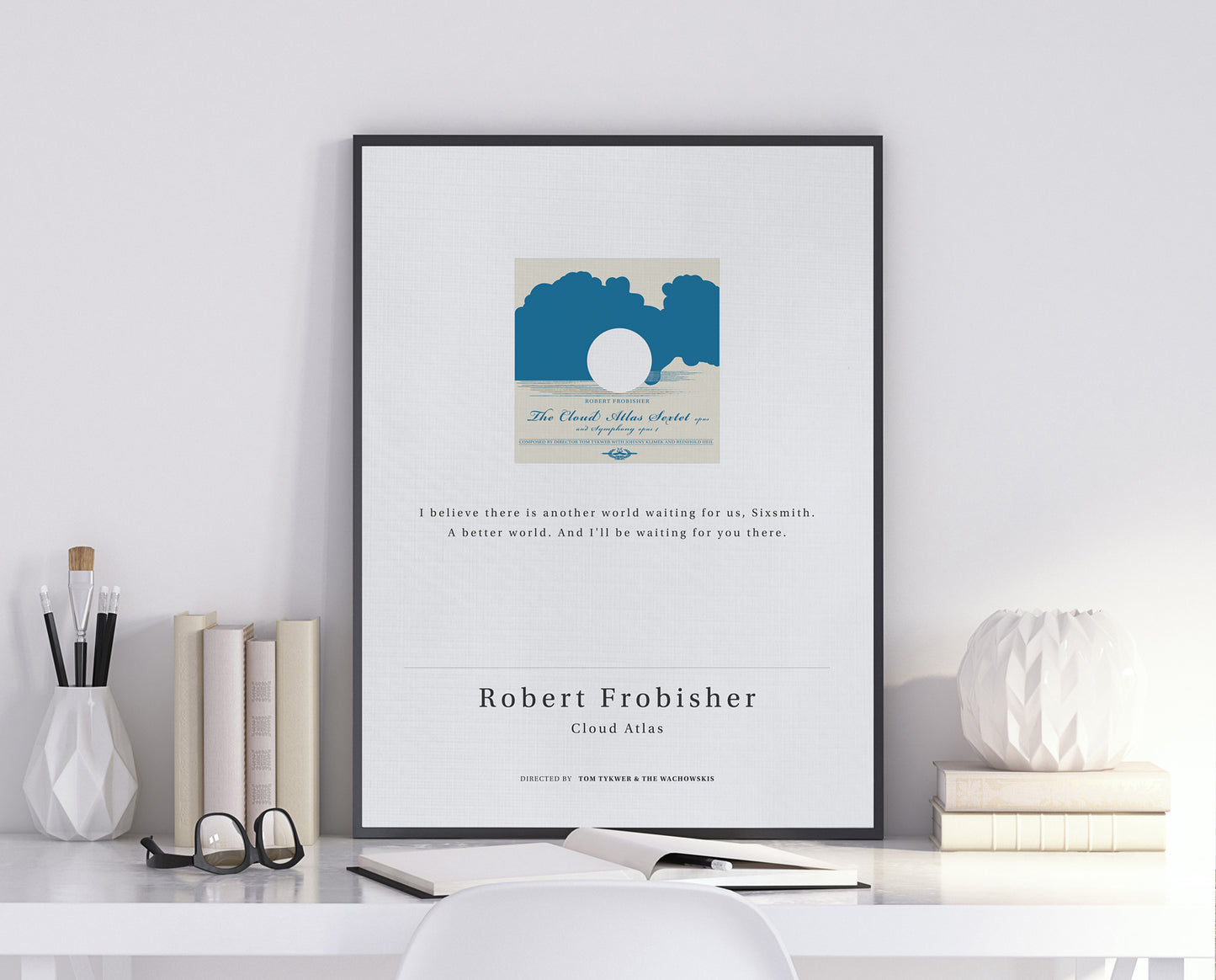 Cloud Atlas movie quote digital poster featuring Robert Frobisher’s quote "I believe there is another world waiting for us, Sixsmith. A better world. And I'll be waiting for you there." on an off-white background with an art design of the Cloud Atlas Sextet vinyl record album.