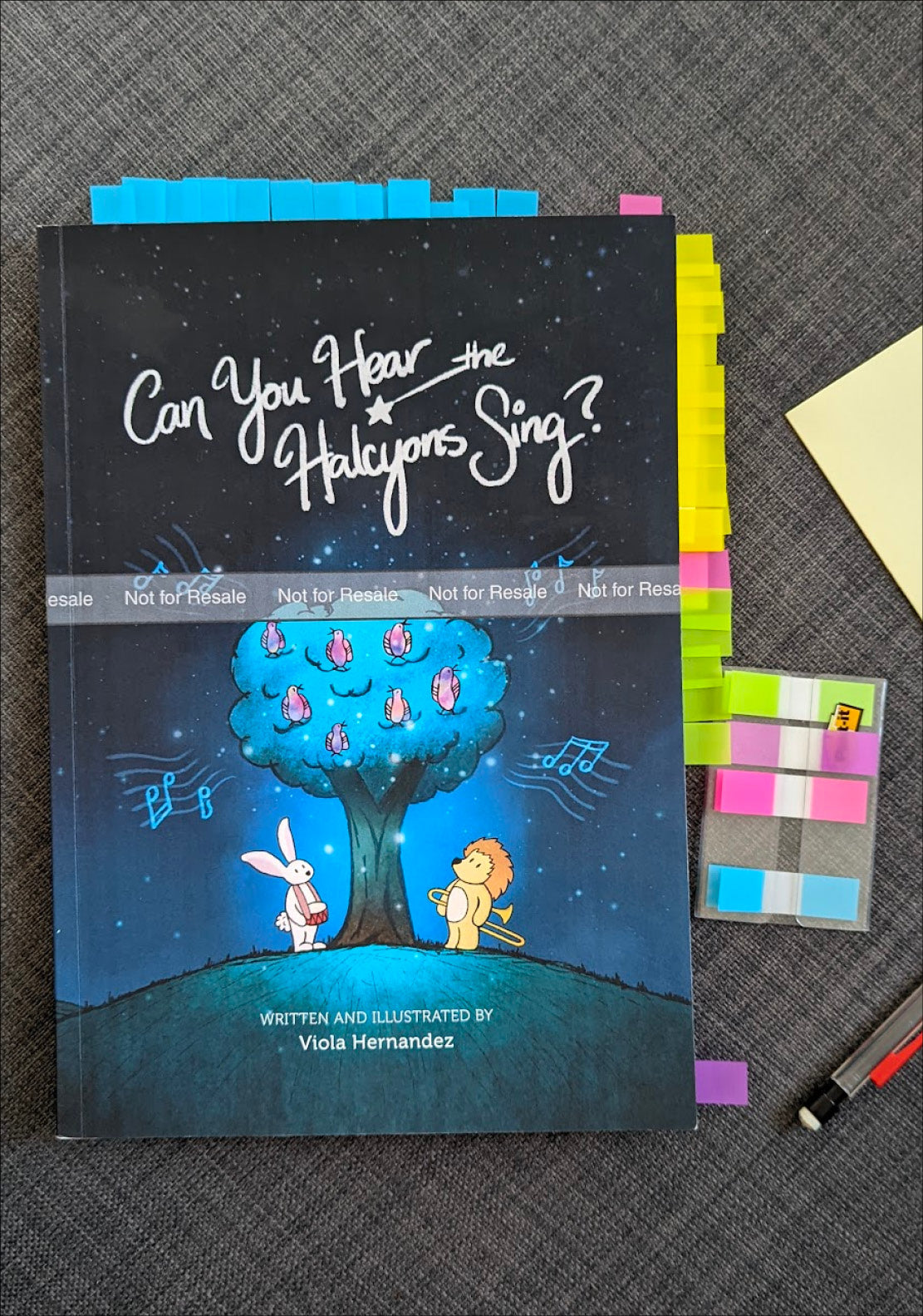 Image of a children's book with colourful sticky tabs